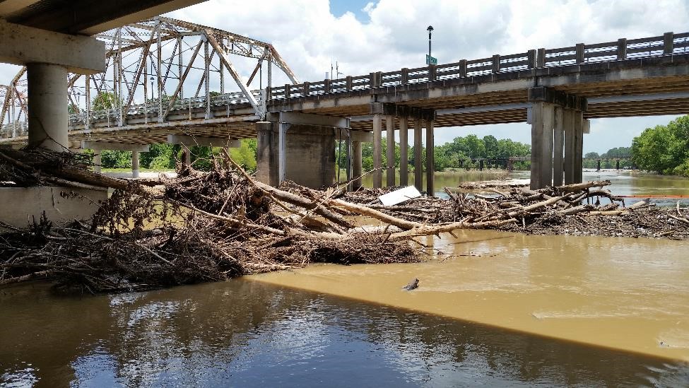 bridge with debris in the water